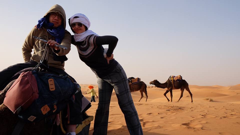 Camel trekking at sunset in the Sahara on a Marrakech to Fes desert tour